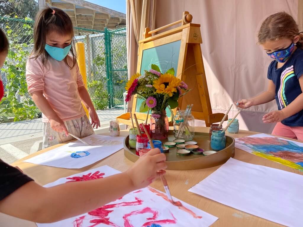 Children painting at the Early Childhood Center